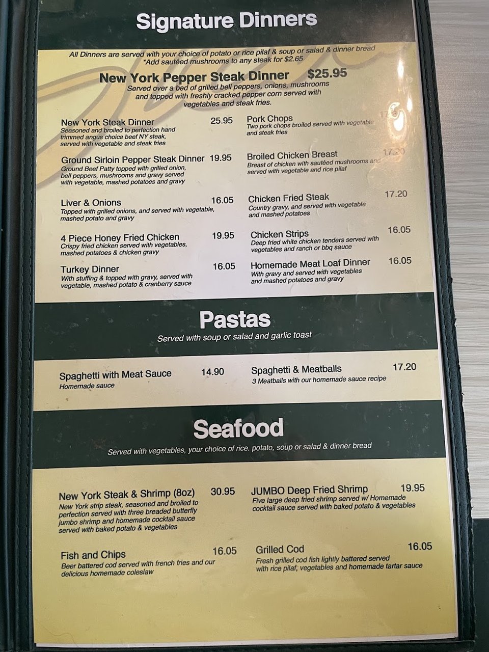 Menu board with tacos and burritos.